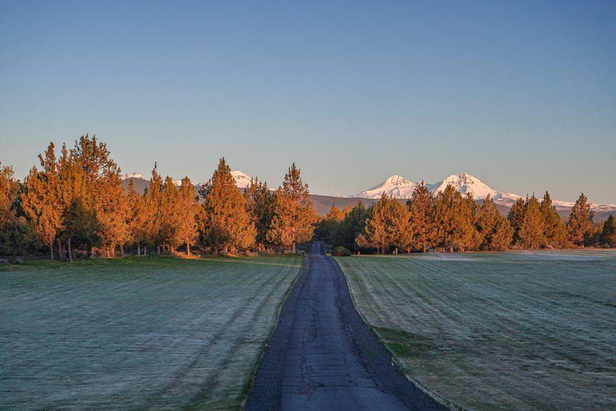 A stunning 18 acre lot with unobstructive views of both the Deschutes river and all 7 of the Cascade Mountain Peaks. This flat lot sits on the rim above the Deschutes river abutting Tumalo State Park. It enjoys approximately 8 acres of irrigation rights with an almost equally large open meadow. A private, gated entrance leads you into this partially fenced and landscaped, picturesque future homesite, which has a CUP building permit currently in place. Perfectly situated on the border of Bend and Tumalo with a 5 minute drive to convenient stores (Trader Joes/Target) as well as sought after schools (North Star Elementary/Cascades Academy).