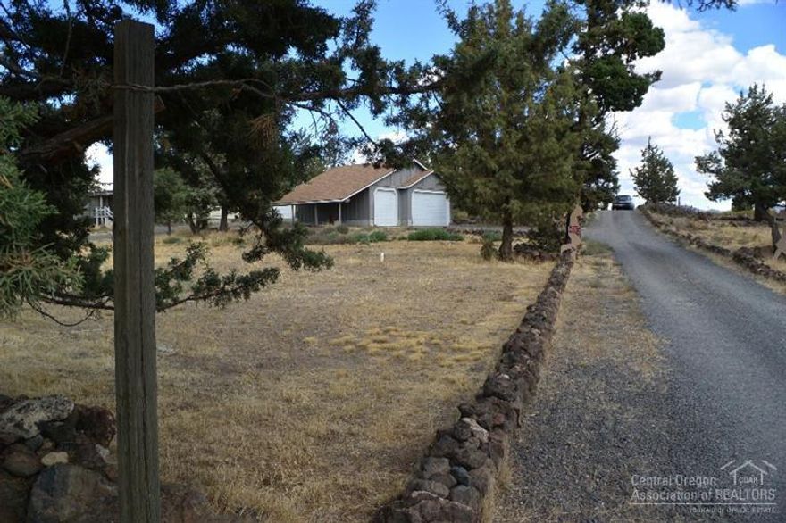 Nice manufactured home in Crooked River Ranch. Cascade Mountain views and Smith Rock. Features New Roof, vaulted living room with fireplace, family room, dining area, and kitchen with breakfast bar. 3 bedrooms & 2 baths. Situated on just over an acre with detached 3 car garage, surrounded by mature trees. Plenty of room for an RV and animals, plus all the amenities of CRR including golf, tennis, and swimming pools.
