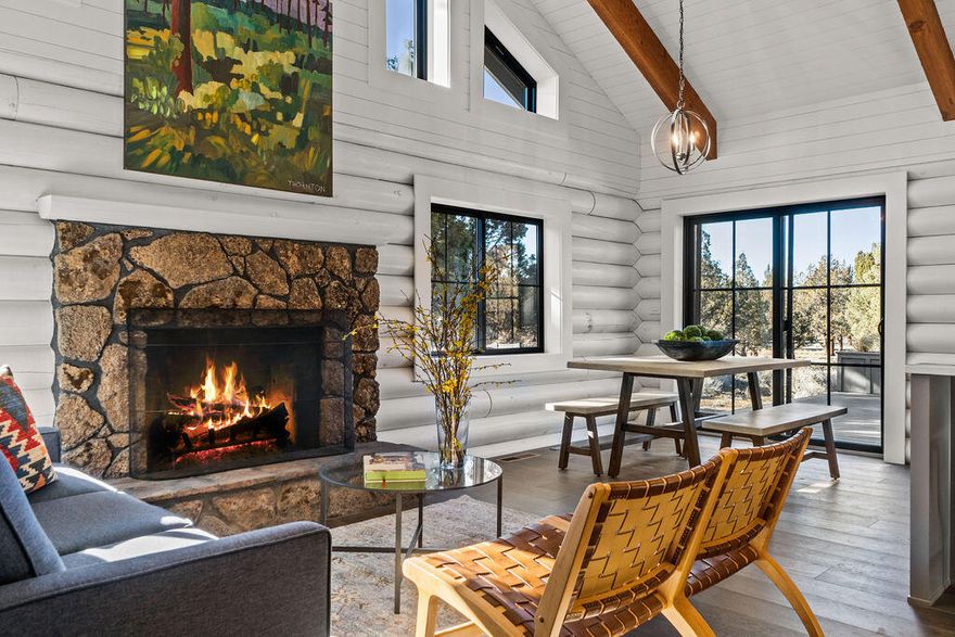 Stylishly renovated with everything you need to kick off your Bend adventures, this classic Northwest style home offers beautiful Cascade Mountain views on 3 private acres in the desirable Boonesborough neighborhood. Stunning beamed ceilings and a cozy wood burning fireplace invite you into the great room. The well appointed kitchen has quartz countertops, new stainless steel appliances, & island with breakfast bar. New Andersen windows, shiplap interior walls, and matte black fixtures & hardware create a warm and modern feel. Wake up to Cascade Mountain views from the upstairs primary bedroom, the ensuite features radiant floor heating, tile shower, dual vanity, and walk-in closet with custom closet system. The spacious loft adjoins an office nook along with an upper deck to take in the mountains. Three additional bedrooms are downstairs including a second primary. Outside, enjoy Trex decks & paver fire pit, new asphalt driveway, and finished 2-car detached garage with epoxy floor.