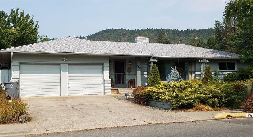 Charming home in nice NE Grants Pass Neighborhood, across from the Mormon Temple. Must see this 3-bedroom, 3-bathroom home; with hard wood floors in 2 bedrooms, living and dining rooms, tile in the kitchen and breakfast nook, wood-burning fireplace, large master bedroom walk-in closet with sitting area and much more. The low maintenance front yard is but the beginning...