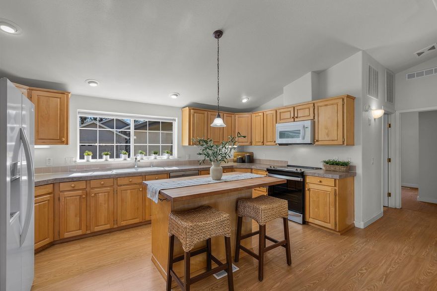 Single-level living in The Pines, a desirable 55+ gated community in the heart of Sisters. This home offers vaulted ceilings, an open floor plan, and a well-designed kitchen featuring maple cabinets, a center island with breakfast bar. The spacious primary suite includes dual closets, a walk-in shower, and a soaking tub. Enjoy outdoor living on the covered front porch or back deck overlooking the peaceful common area. Additional highlights include an attached double-car garage and low-maintenance living with HOA covering landscaping and snow removal. Conveniently located near shopping, dining, and all that Sisters has to offer.