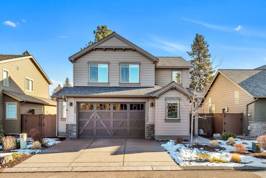 Spectacular Fitzgerald plan by Pahlisch Homes in River's Edge Village! Steps to the River Trail and views of the Golf Course. Extremely well cared for by the original owner with all luxury finishes: quartz countertops, engineered hardwoods, SS appliances, crown molding accents, wood built-ins, A/C, private low maintenance yard with garden shed, salt-water hot tub, extra storage space in garage and pocket den/office in main level with wood built-ins. HOA covers snow plowing in streets, landscaping and tennis courts. Close to shopping, parks, trails, Parkway and Downtown. The perfect NW Bend dream home!