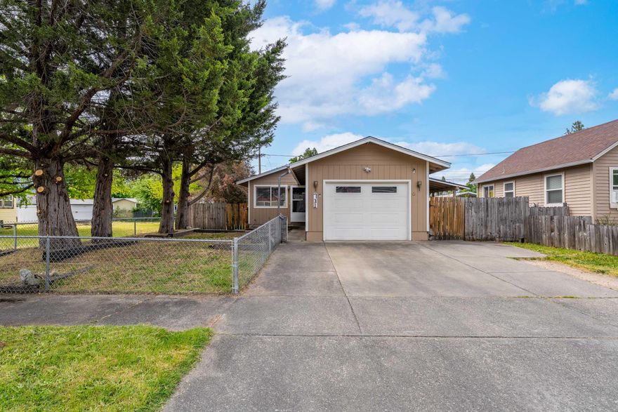 Charming move in ready home located in the heart of down town! This cute and clean 3 bedroom, 1 bath home has had many recent updates including; fresh interior paint throughout, new laminate flooring, a refreshed kitchen with new counters, modern painted cabinets, new backsplash, stainless-steel appliances and a new water heater. It sits on a very usable and roomy .12 acre lot, that is fully fenced- the large backyard has a gate that opens to the alley allowing for additional RV/boat parking. This sweet home would make a wonderful first-time home or investment property, it offers a welcoming and cozy, open floorplan and is awaiting new owners! Close to local favorites; farmers market, coffee shops + restaurants. Call today to schedule your tour!