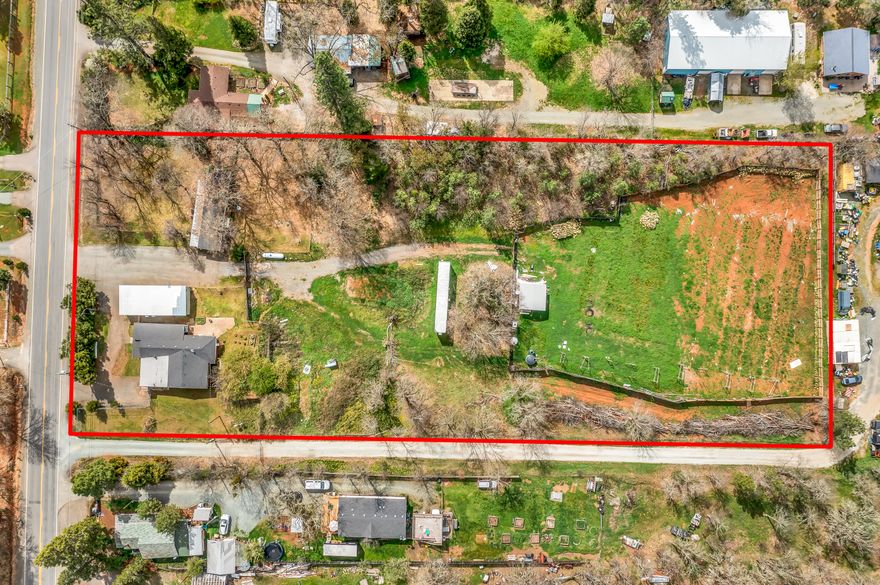 Looking for a family-compound at an inexpensive price? If so, this is the one for you! 2 dwellings for this price of one, this beauty features a freshly remodeled 3 bed, 1 bath, 1690 sq ft home, a 1967-built 2 bed, 1.5 bath, 716 sq ft, single-wide, 3 useable acres, detached shop, and much more! Within the main house, seller spared no expense during the remodel by installing a new roof, new interior paint throughout, new 390 sq ft porch, remodeled bathroom, new laminate flooring, new backsplash in the kitchen & bathroom, new light fixtures, new trim, new 1500 gallon propane tank (completely full), new doors, and much more! Spacious galley kitchen features ample cabinetry, walk-in pantry, reverse osmosis system, and spacious countertops. Each home has its own meter and septic. RV parking with sewer and power hook ups available. Furniture accessories included! Such a rare-find at this price-point so contact your agent today for a personal tour, before it's too late!