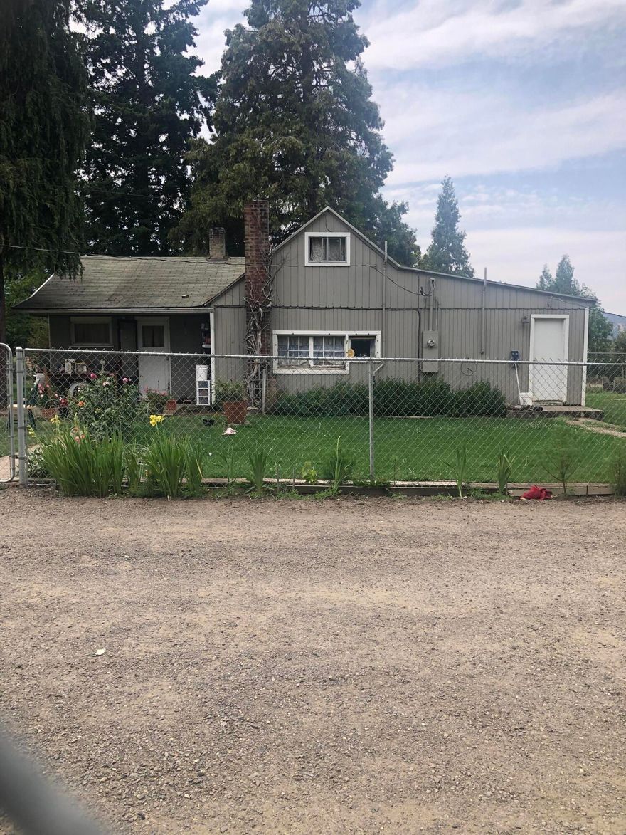Farm house on just under 15 flat acres.  Home is well kept with maintained landscaping and has panoramic mountain views.  Currently being used as a pear orchard and has an underground sprinkler system that covers approximately 14 acres of the entire planted tree area.  Irrigation water is being pumped from a neighboring property and a new pump would have to be installed to have independent use and access to TID water.  Both properties are currently under the same ownership.  Well was tested at 10 GPM in 2016.  Buyer to perform own due diligence regarding use of this property.  Needs to close after 11-1-2021 or 60 days tenant rights whichever is later.  Listing agent is related to sellers.
