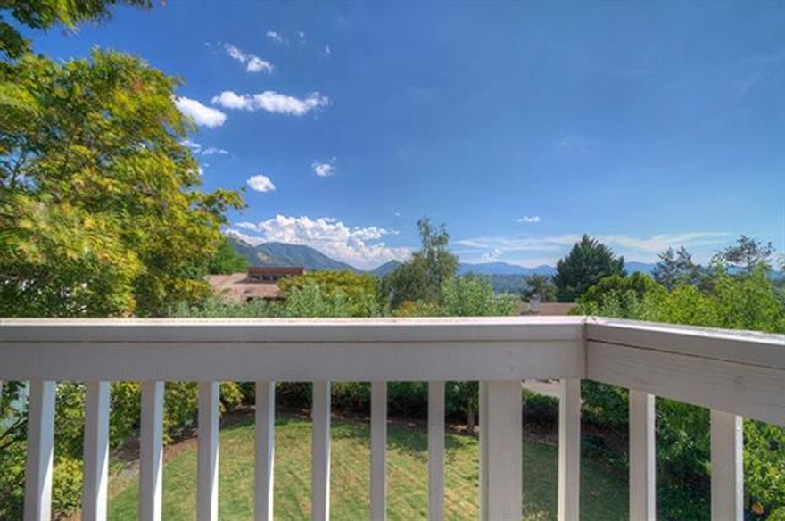 Enjoy Spectacular Mountain, City and Valley Views from this Lovely 3 Bd., 2 Bath, 2268 Sq. Ft. Home! Tucked away on a Well Established Cul De Sac in a Desirable NE Location, You'll be just Minutes to Freeway, Schools, Shopping and Services, yet enjoy all the Privacy this Beautiful Property has to Offer. With Attention to Detail, the Spacious Yard has been Professionally Landscaped and Boasts Terraces, Sprinklers, Expansive Redwood Decking, Blueberries, as well as its own Mini Orchard with Asian Pears, Peaches, Fuji Apples and Cherries. Inside you'll enjoy the Views from the Kitchen that Features Stainless Steel Appliances, Granite Counters and Plenty of Cabinets. Downstairs has Two Bedrooms in Addition to a Generous Room with Slider that would be the Perfect spot for Entertaining, Game Room, Office or even a 4th Bedroom. Wrap around Decking ensures you'll Enjoy a Gorgeous View in every Direction. Make an Appointment today! Once you take a look, you'll want to call this HOME!