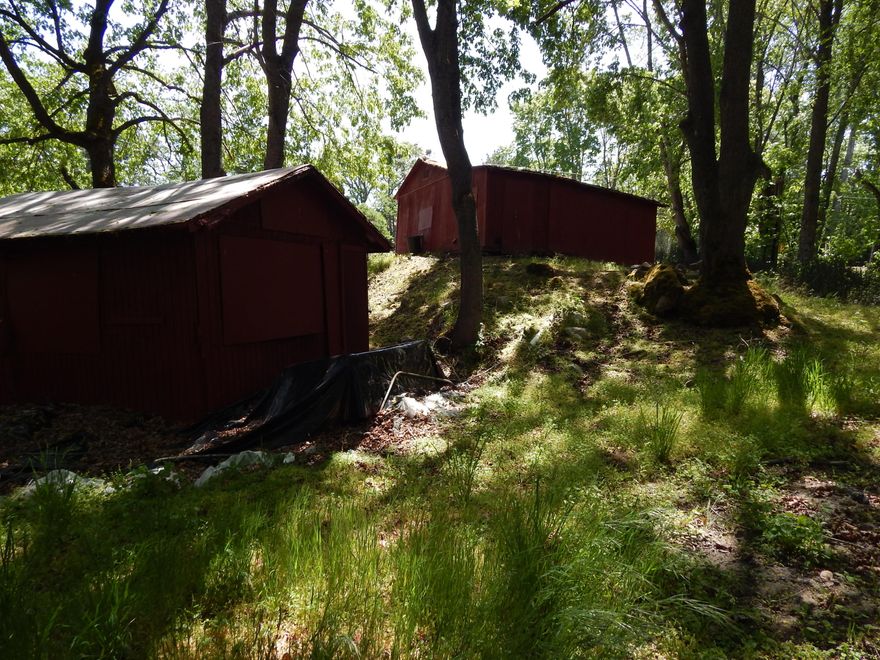 Wanted:  Creative Buyer.  This .34 acre piece of land zoned RR-5 is located just outside of Ashland.  It is country, pure and simple.  The property has a woody ambience with a picture book setting by Neil Creek.  A recent survey of the property has been done and the seller has received a Type 2 land use decision from the County.  There are two storage sheds on the property which would need to be removed in order to build a home.  The seller has prepared a conceptual idea for a living space above a garage.  Any potential buyer would need to consult with the County regarding building requirements. Let yourself imagine the possibilities and celebrate Nature.