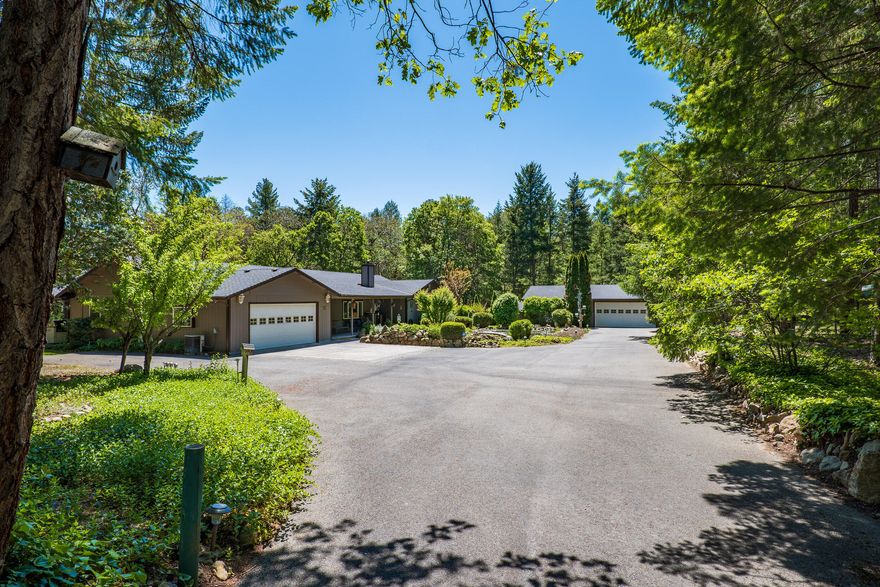 Paradise in the Applegate Valley! This charming country home sits perfectly on a flat 5.4 acre lot complete w/ a generous amount of trees & sunshine for you to enjoy year-round! Nicely set back off the road, this 2400sf home features an open living space w/ vaulted ceiling, cozy wood stove, a well-appointed kitchen featuring a large center island, massive pantry & breakfast bar plus a cozy family room & dining room w/ doors to the covered patio & back yard. Comfortable floorplan includes a large primary bedroom w/ an ensuite bath complete w/ walk-in shower plus a spacious guest room, bathroom & large laundry/mud room. Additional features include a bonus room off the master, perfect as an office or craft room & it includes a hot tub! Don't forget the attached 2-car garage, another 2-car detached garage/workshop & a large RV/Boat barn out back! Also outside you'll find a large woodshed, fruit trees, grape vines, garden beds, pond security gate & much more! Call today to schedule a tour!