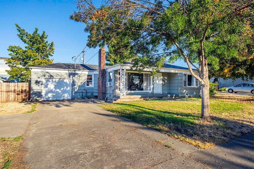 Location, location, location! Searching for a charming single level home close to everything Medford has to offer? If so, this is the one for you! Priced to sell, this property features 2 bedrooms, 1 bathroom (shower/tub combo), 1092 sq ft, spacious back yard, hardwood flooring, heated tile flooring in the large kitchen, tile countertops, single car garage w/ new garage door, rear & front porch, woodburning fireplace, & much more! Over the last 5 years, sellers have done tasteful updates such as updating the light fixtures, ceiling fan, electrical panel, hot water heater, and various other touch ups! Perfect opportunity for anyone looking for a low maintenance property with so much to offer! This one won't last long on the market, so contact your agent today for a personal tour, before its too late!