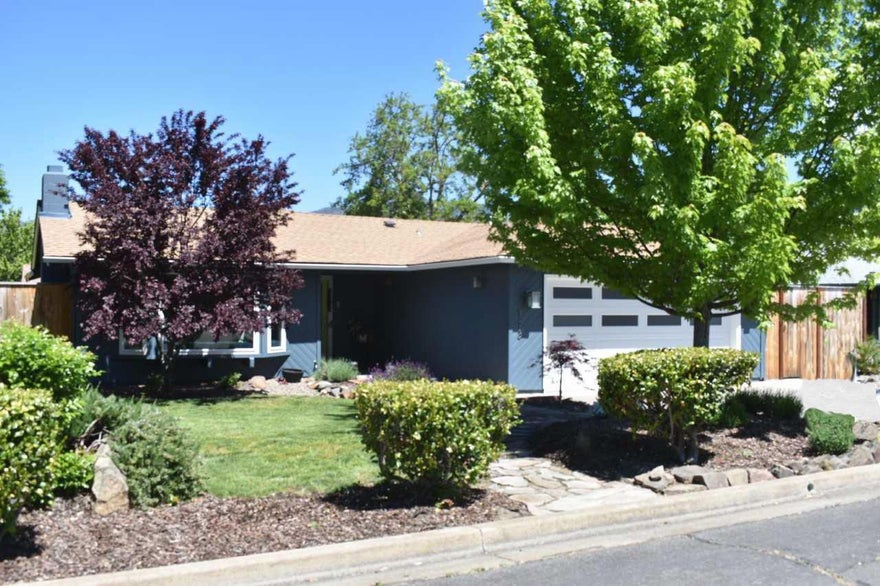 Welcome home to this light, bright and completely renovated 3 bed, 2 bath home. Spacious kitchen with informal eating area and sliding glass doors to the backyard is equipped with custom built cabinets, stainless steel KitchenAid appliances, recycled glass counter tops and recessed LED lighting. Kitchen flows to the comfortable living room outfitted with a wood burning fireplace, vaulted ceiling, and a bay window. A sliding glass door from the master bedroom opens to the private patio and large backyard. Master bedroom features vaulted ceiling, walk in closet, Carrara marble tile shower and vanity top. Other amenities include; Hickory engineered hardwood and Marmoleum flooring, solid wood doors throughout, Hunter Douglas blinds, fresh paint inside and out, extended concrete patio, updated plumbing, newer gas heater and furnace, air conditioning and duct work and much more. No expense has been spared!