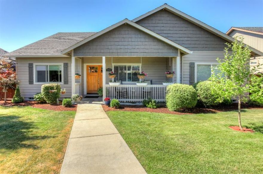 Immaculate & turn key 3 bedroom plus office home w/beautiful upgrades! Situated on .19 acre, this 1900 sq. ft. home will welcome you w/newly refinished hardwood floors, vaulted ceilings & custom art niches. Spacious family room features gas fireplace & ceiling fan & is the perfect spot to unwind. Beautiful kitchen was updated w/custom tile backsplash & under cabinet lighting. Stunning custom cabinetry, granite slab counters, island & stainless steel appliances including gas range/oven. Dining room is off the kitchen w/ french doors to backyard oasis. Master suite retreat is spacious w/french doors to deck, bath w/ double vanity, soaking tub, shower & large walk-in closet. 2 additional bedrooms plus an office that could be used as a 4th bedroom. Backyard w/ deck that offers additional storage underneath. Gas Grill, flagstone patio, raised garden beds & a wonderful view of Mt. McLoughlin. Large fenced front yard w/grass area & front porch. You will love this house!