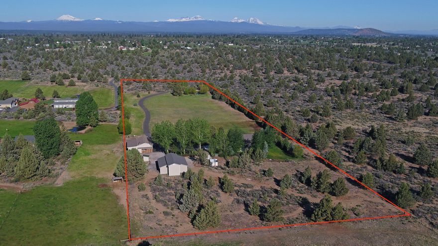 Single level on 10 acres with mountain views. Well maintained home, updated windows, roof, granite counters, hot water heater with 2 circ. pump. Nice master with private access to hot tub, all bedrooms have walk-in closets. Fully fenced private setting with public lands on two sides. Bring your toys, double garage, large insulated shop w/200 amp service. Huge 3 bay ag building w/cement floor, can easily accommodate full size motor home. Your guests are sure to enjoy the wonderful outdoor entertainment area with firepit, lighting and covered bar area. Dog kennel, animal pens and shed. Move in ready! This property is extremely well maintained and ready for a new owner.