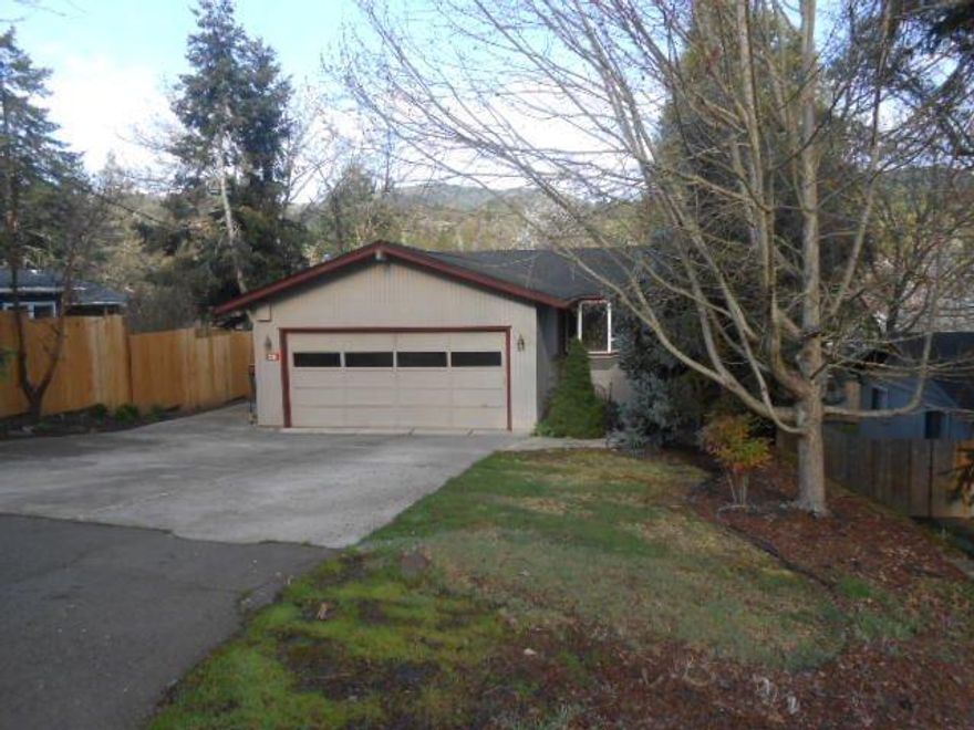 This is a wonderful bi-level home within walking distance of downtown Jacksonville. Hardwood floors, open kitchen/dining/living room floor plan with a fireplace for cozy evenings. There's a garden window in the kitchen which boasts granite counters and lots of cupboards. The master suite has a large walk in closet and features French doors to the deck overlooking the huge backyard with has mature landscaping and a wonderful in-ground pool. The outdoor sauna needs some love but could be restored. Buyers to do their own due diligence.