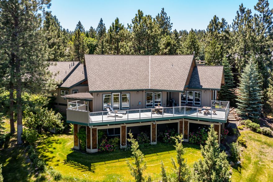Swoon-worthy views of the snowcapped Cascade Mountains greet you the moment you enter this beautiful home. This private retreat nestled among the trees is situated on nearly an acre in the coveted Awbrey Butte neighborhood. Thoughtfully designed custom home showcases the stunning views inside and out. Impressive great room features vaulted Knotty Alder ceilings, floor-to-ceiling stacked stone fireplace, and built-in media center. The chef's kitchen is the heart of the home, adjoined by dining and great rooms, making it ideal for gatherings. Spacious main level primary suite features private access to the deck, and an en suite with sizeable tile shower. Expansive lower level has two additional bedrooms, a large family room with fireplace and wet bar, and access to covered porch. Professionally landscaped yard with a water feature, pavers, and lovely flowering shrubs. Large triple car garage and heated driveway. Within minutes to quality schools, river trails, and Mt Bachelor Ski Resort.