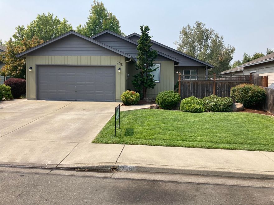 This property is move in ready.  Featuring an open floor plan with 3 bedrooms and 2 full baths.  Hard surface flooring throughout.  Spacious master bedroom with walk-in closet and sliding glass door that opens to a nice rear patio with pergola.  Professionally landscaped front and rear with inground sprinklers.  This property backs up to a large parcel and is very peaceful and private in the backyard.