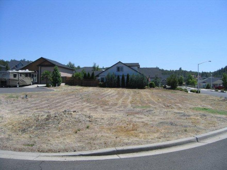 This wonderful large .26 acre residential lot is located in the Hillsborough Estates Subdivision. Adjacent to the Eagle Point Golf Community and located on the corner of Milagros Ct. When the home is built, it will allow for utmost privacy. Building plans have been purchased from a well know local Medford Architectural firm. The complete building plans are for a 2600 sq ft. single story home and is included with the purchase of this lot if desired! The lot has a nice shape in terms of contour and accomodates the plans, 2.5 car garage, and RV barn/garage. It is one of the best lots available in the area. Priced to sell!