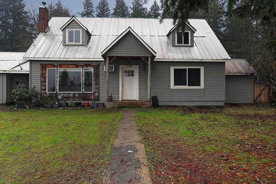 Here is your opportunity! Absolutely charming farm house on 5.12 acres. Level, usable pasture offers room for horses & farm animals or space for a garden. Home is 4 bedroom and 2 bathroom with 1722 square feet and set in such a prime location!  A rural feel, but only 20 minutes to Grants Pass and 10 minutes to Cave Junction for town services and conveniences. The shop, utility room and carport are attached by a breezeway to the house. Rustic barn on the property was used for livestock. Pasture is fenced and cross fenced. The well tested at 9.4 gpm in 2019. Visit the seasonal creek at the south corner of property and the forested hillside behind the home while taking in the country air. If you enjoy farm projects, this home and property offer space and privacy! Ask your agent how to make it yours! Call for more information and your tour today.