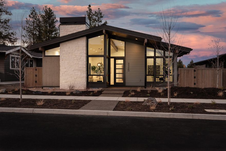 This single-level Mid-Century Modern home by Structure Development NW blends timeless design with modern luxury in Bend's sought-after Discovery West neighborhood. Thoughtfully crafted, it features 3 bedrooms, 2.5 baths, and a versatile den—ideal for a home office or guest space. The open-concept layout offers seamless flow between the living, dining, and kitchen areas, highlighted by clean lines, expansive windows, and abundant natural light. The gourmet kitchen is a showstopper with high-end appliances, custom cabinetry, and a large central island perfect for entertaining. The primary suite includes a tile shower, dual vanity, and walk-in closet. Two additional bedrooms ensure plenty of space for family or visitors. A spacious 3-car garage provides ample storage, with a third bay tall enough to accommodate a Sprinter van. Professionally landscaped and designed for outdoor enjoyment, this home sits in a vibrant, walkable community known for parks, trails, and architectural diversity.
