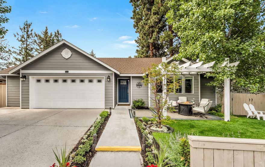 This delightful SW Bend cottage style home is perched on a large lot above the Old Mill and is sold fully furnished with everything you need to experience the Central Oregon lifestyle for yourself or as a rental property. Thoughtfully designed single level with open vaulted living spaces, lots of natural light and outdoor living options, the 3 bedroom and 2 bath floor plan make it ideal for a variety of living situations.  The home has central air conditioning and has been thoroughly updated within the past three years with new lighting, custom gas fireplace, Lennox gas furnace, water heater, irrigation system and all appliances to give you years of carefree living. The oversize garage has room for a shop, storage, and even a Man Cave area with a large TV. There is a huge fully fenced private yard ideal for pets. Also included are 3 outdoor storage sheds as well as a large area that can be used for RV parking, a greenhouse, or outbuilding.  11 minute walk to the Old Mill.