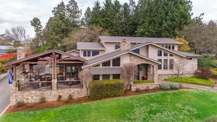 This home is truly spectacular! Fabulous remodeled kitchen with custom cabinetry, professional appliances, 2 dishwashers, Quartzite slab counters, and HUGE island. The spacious, window-surrounded kitchen, has custom hardwood floors and opens to vaulted great room with fireplace and walls of windows to the beautiful outdoor flagstone patio, fireplace and bar with built-in gas bbq. Luxurious master suite is a couple's dream with double steam shower, tv, coffee bar, huge closet and a hidden stackable washer/dryer, travertine heated flooring and double doors opening out to pool and hot tub. 3 additional suite-style bedrooms, each with own full bath. Dedicated office and a family room which leads to private backyard with in-ground pool, hot tub and half bath. The mud room keeps the family laundry and clutter hidden and even has a dog shower! Oversized 2 car garage with space for golf cart. All this and across the street from the beautiful RVCC & 5 mins to each major hospital.