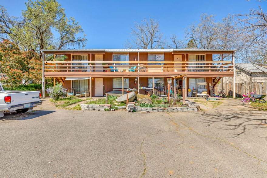 Attention all investors and individuals seeking a unique four-plex opportunity! This exceptional multi-family residence is located in the Ashland neighborhood and offers spacious two-bedroom, full bathroom units. Each unit, approximately 856 square feet, includes a kitchen with a range/oven, range-hood, refrigerator, a living room, in-unit laundry room with washer/dryer hookups, & a linen closet. Additionally, there are dedicated storage sheds (approximately 4x4x10) at the rear of the property, along with private off-street parking for both tenants and guests. The roof was replaced in 2004, and the property is built on a slab foundation, with all units having separate electric meters. This convenient location is just half a mile from downtown and only a few blocks away from local markets, restaurants, and shops. Currently, all units are leased on a month-to-month basis to qualified tenants with excellent payment history. The monthly lease includes owner-paid water, sewer, and garbage.