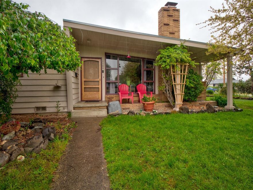 Mid-Century Modern home with the white picket fence to boot! This single-level 3-bedrrom/2-bathroom home rests in a quiet West Medford neighborhood. Featuring a combination of re-finished oak and LVP flooring throughout, the home is ideal for pets and kids. Granite countertops in the kitchen and a fireplace in the living room add both sophistication and charm. Out front enjoy beautiful landscaping and trees that provide both curb appeal and privacy. Check out the landmark Mulberry tree! The backyard is fully fenced and easy to enjoy with a paver patio. With a spacious over-sized garage and RV parking, this corner lot will be gone soon!