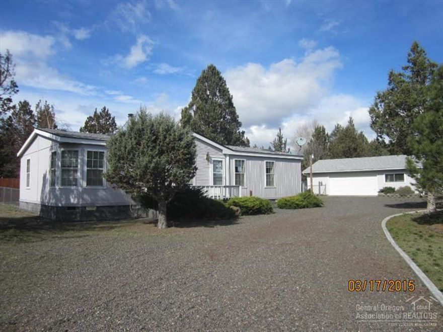 Nice one level home on fully fenced and Gated 1.17 Acres. Trex Deck. Nice Detached garage with work shop.