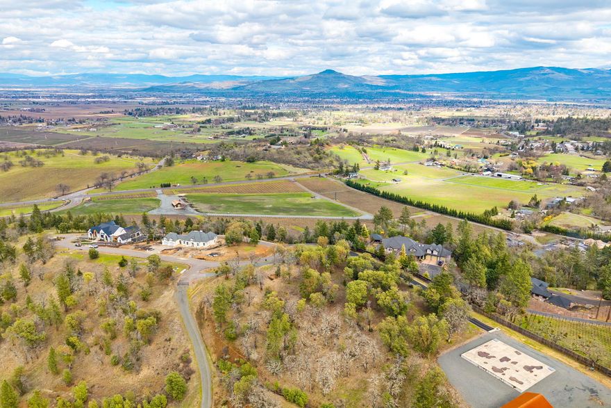 Secure your place within Stage Pass, an exclusive luxury gated community, and build your dream home on one of its premier lots. This expansive 2.65-acre parcel, nestled beside Dancin' Winery and Vineyard, offers unparalleled panoramic views and direct access to 110 acres of hiking and biking trails.  Jacksonville's Britt Music & Arts Festival and Ashland's world-renowned Shakespeare Festival are just minutes away. Owners will enjoy the peace of mind provided by Stage Pass's exceptional, state-of-the-art community water system.