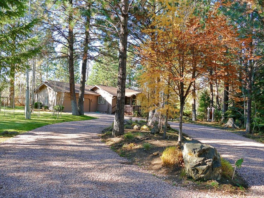 Tollgate beauty! Updated in 1997 with added master suite, pine floors, open concept, title and granite, new entry and front deck. Light and bright with skylights and solar tubes. 1536 sq ft of cozy comfort with propane fireplace in living room. Great quiet location. Gorgeous landscaping. Water feature with small stream & pond. Two garden areas with deer fencing. Enjoy the quiet solitude from the back deck off the master suite.<br>