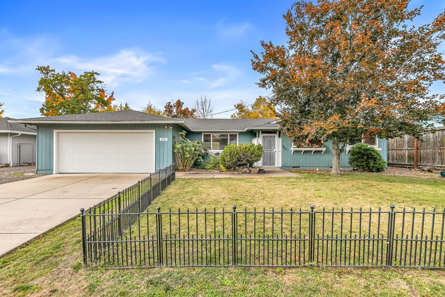 Charming Family Home with Modern Upgrades and Prime Location! Beautifully updated with a 2025 kitchen remodel featuring custom wood cabinetry, granite countertops, and designer lighting, this home blends timeless craftsmanship with modern elegance. Enjoy new commercial-grade flooring, crisp baseboards, and a cozy great room with a brick fireplace and warm shiplap walls. The spacious backyard is ideal for entertaining, play, and gardening, complete with a covered patio and serene mountain views. Located just  a short distance to Larson's Creek with scenic trails, minutes to St. Mary's and the hospital, and less than 2 minutes to Orchard Hill Elementary. The perfect balance of comfort, charm, and convenience in one unbeatable location.