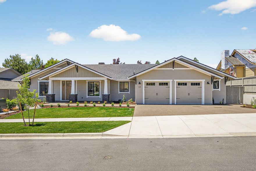 New 2025 Construction by Mahar Homes, Inc. This beautiful single-level Craftsman in East Medford's Summerfield neighborhood showcases the quality and design Mahar is known for. Light, bright, and stylish, it features light wood floors, quartz countertops, an island kitchen with butler's pantry, vaulted ceilings, and custom cabinetry. The open great room centers around a gas fireplace, and designer tile enhances the bathrooms and laundry room. Includes wide baseboards, wood-wrapped windows, and a Jack and Jill bath layout. The private primary suite offers a spa-like bath with a floating tub and walk-in closet. A large laundry with built-in mudroom and an oversized two-car garage with shop space for flexibility. The covered patio is ideal for summer evenings and entertaining. Milgard windows, HardiePlank siding, tankless water heater. Fully landscaped, fenced, and Earth Advantage Certified. Listing agent is related to seller.