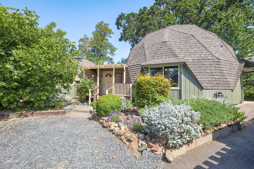 Discover the charm and character of this one-of-a-kind 2 bedroom, 2 bath geodesic dome. This architecturally distinctive two-story home features a bright, open interior with skylights, brand-new windows, and warm wood accents throughout. The functional kitchen comes equipped with new appliances, and an updated electrical panel adds peace of mind. Enjoy a private backyard retreat with a wonderful deck surrounded by mature landscaping including a fig tree, cherry tree and grapevines. Centrally located, this property touts a rare blend of creativity, comfort, and convenience. Perfect for a primary residence, artistic retreat, or investment opportunity. Schedule your tour today and come take a look at this unique property! Priced below recent appraisal.