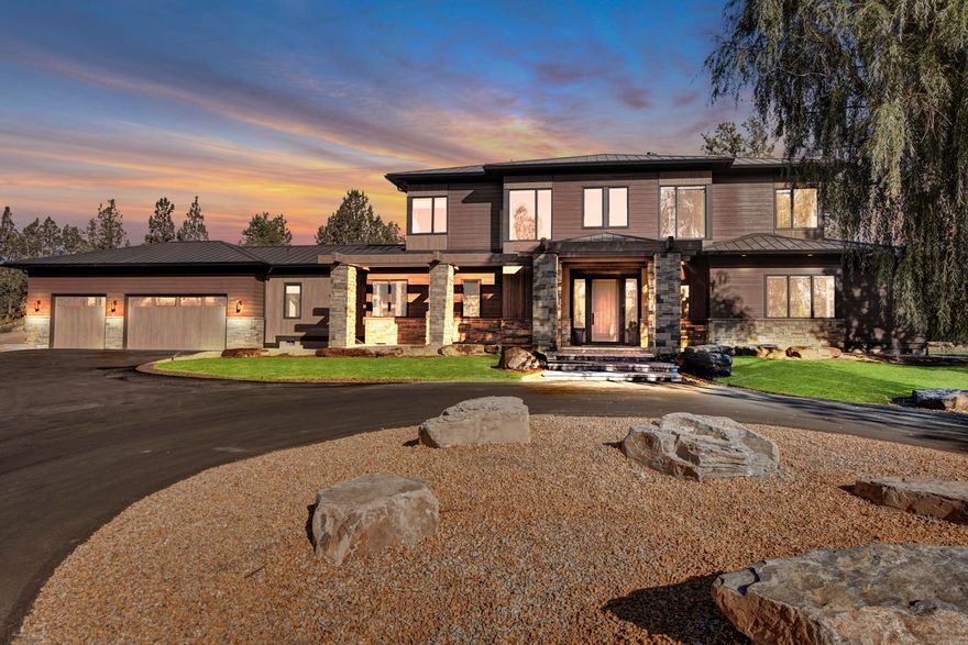Amazing Riverfront Estate located on the Deschutes River in Tumalo just outside of Bend, OR.  Built in 2016, the 3364 sq. ft. main home sits just off the river creating an amazingly peaceful and serene setting for this 5.67 acre, tree lined property.  Two fully finished RV garages located to the east of the main home round out this spectacular estate.  3 beds, 3.5 baths with master on the main + office in main home. Beautifully finished living area, kitchen and bathroom in the 686 sq. ft. guest quarters attached to the 1st of 2 fully finished RV garages. 
Winner of Best Master Suite and Best Feature for its double iron staircases in the COBA Tour of Homes, no detail was missed in the construction of this home. Float the river, fish out your back yard, enjoy 3.2 acres of irrigation for the beautiful field and so much more.  A home built for your dreams and able to house all your toys.