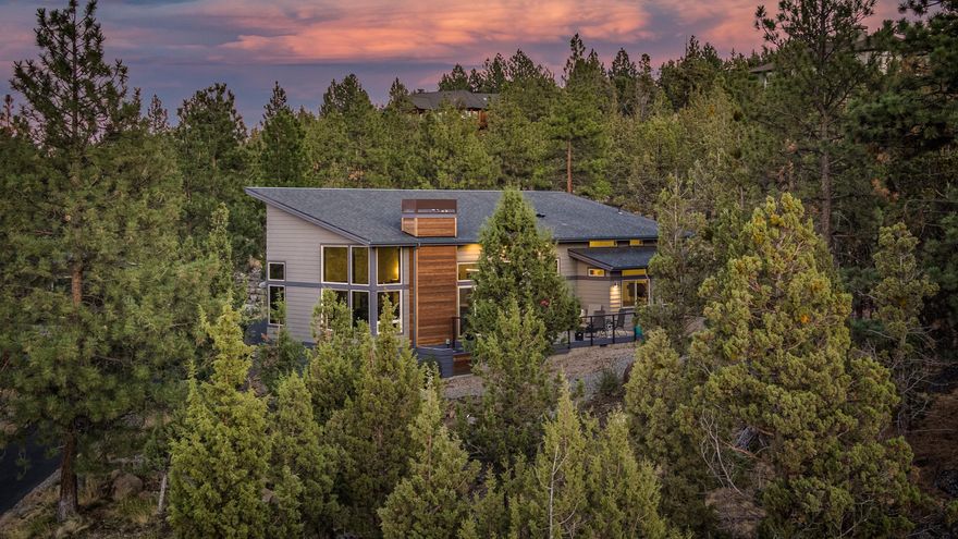 Expansive Cascade Views from this luxurious 3-bedroom + den, contemporary, custom home on Awbrey Butte. 50 wood wrapped windows, 13 foot ceilings, 4th bedroom is an office w/cut out for closet for 4th bedroom.  Home has music insulation throughout.  Windows have UV coating to protect hardwood floors. Very private setting.  3 car garages/extended length w/storage shed behind garage.  Basement has on demand water heater, heating system and storage, currently storing wine!  Art Gallery entry way, custom interior doors, chef's kitchen with quartz counter tops.  The Guest en-suite has full shower with custom shower doors as does Master Suite with shower and tub (separate but inclusive) w/desirable custom glass and tile work.  Master Bathroom backlit mirror + lighted makeup mirror + extras. Landscaping includes irrigation in zones closest to the home with native plants on exterior zones.  Waterfall with pond near entrance of home & courtyard. .81 private acres in highly desirable Awbrey Butt