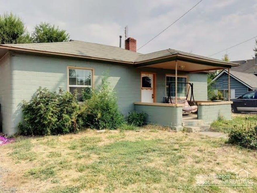 Charming 2bd/1bath Cottage style home with wood burning fireplace in town. Original hardwood floors in living room, bedrooms and newer vinyl in the bathroom, utility and kitchen/dining. Large utility room with loads of storage!