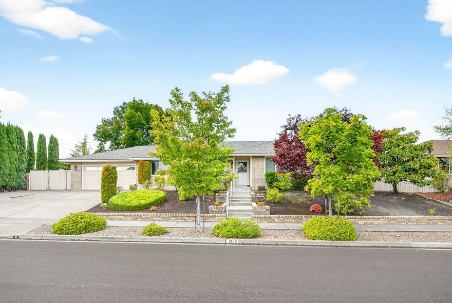 Welcome home!  This home is located in one of Medford's most sought after established neighborhoods! This beautifully maintained 3 bedrooms, 2 ½ bathroom home offers 1,791 sq ft of living space on nearly ¼ acre. Inside, you'll find a light filled kitchen with granite counters and large skylight. The oversized living room features a cozy gas fireplace and wall of windows. The primary suite has private patio access and is situated at the back of the home for extra privacy. Updates include a new roof (2025), newer HVAC (2023), and low-flow toilets. Outdoor living shines with a large, covered patio, manicured landscaping, mature Magnolia, Plum & Cherry trees, an in-ground watering system with timers, and a garden shed. A sunroom adds bonus space. Enjoy a spacious 2-car garage with extra storage room and a workspace, plus RV parking with full hook-ups. Move-in ready —schedule your tour today, this gem won't last!