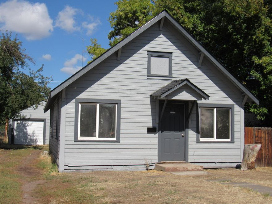 Nicely updated 2 bedroom 1 bath home. It has an updated kitchen, new roof, new garage door, updated electrical panel, new interior and exterior paint and new laminate flooring! Fenced back yard and detached garage.