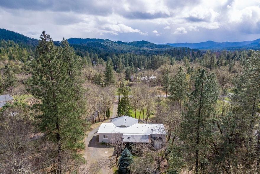 Serene 1.88 acres located in the North Valley area of Grants Pass. Diverse acreage w/ rolling, level, pasture & wooded areas. Plenty of room to build a shop or garden. 3 bedroom, 2 bath & 1668 SF built in 1974. Nice layout w/ both living room & family rooms. Carport, circular driveway, gazebo & 2 garden sheds. Apple, plum & pear trees. White oak, madrone & sugar pine trees. Well is 15 GPM & septic last pumped in December 2019. Interior & exterior were re-painted in 2019. Newer pellet stove & HVAC w/ heat pump system. Vinyl windows, newer roof & newer hot water heater. RR5 Zoning. 10 miles to downtown Grants Pass.