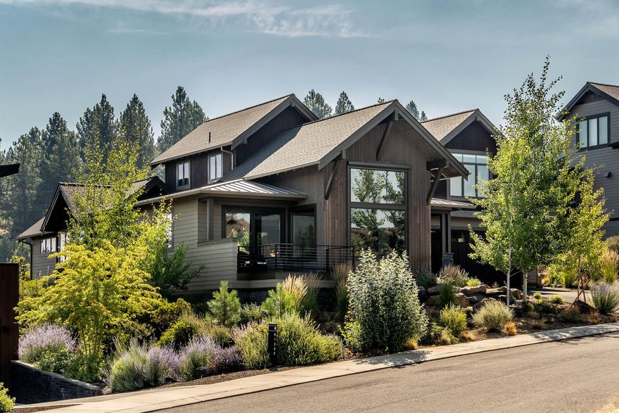 This gorgeous Northwest contemporary-style home, lightly lived in, with 4 bedrooms, primary on main floor, 3 bathrooms, in the desirable Tetherow community has Cascade Mountain views & plenty of privacy backing 14 acres, Alpine Park with trails.  Feel right at home with the open floorplan, large dining area with direct access to the private back patio, eye-catching interior finishes including solid surface counter-tops, large kitchen island, Thermador appliances, modern lighting & gas fireplace, large windows with tasteful window treatments, beautiful hardwood flooring, plenty of cabinets and drawers in the kitchen & primary bathroom with radiant floor heating, & lots of closets and storage space throughout the home.  Sizeable bonus room over-looking the open space & three bedrooms are upstairs.  Garage has workbench, cabinets & plenty of racks for your outdoor gear!  Tetherow offers access to two swimming pools, fitness classes, restaurants, 18-hole golf course, bike trails & more!