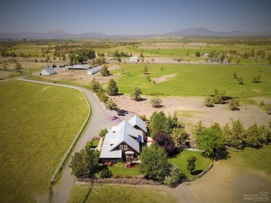 J-T Ranch This one is truly special! 79 acres on Powell Butte's north end. This location features incredible views from a quiet, low traffic, uncongested, country road. The main home is a handsome, high quality, log masterpiece of 3,216 square feet with 3 bedrooms, 3 bathrooms and a wrap around country porch. With amazing landscape and an incredible yard made just for entertaining. The second country farmhouse is 1,417 square feet with 2 bedrooms and 2 bathrooms and has been completely updated.