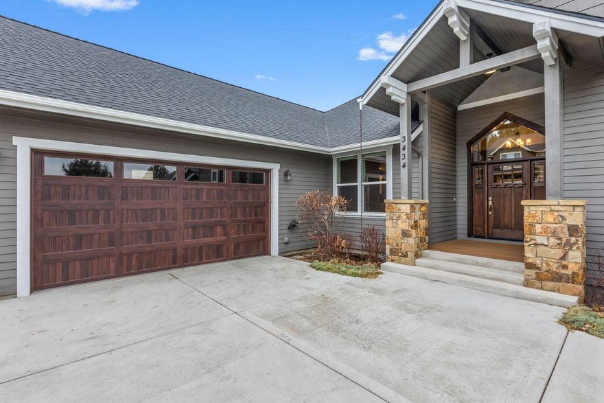 Welcome to 3434 NW Bryce Canyon Lane, a stunning 5-bedroom home offering luxury and comfort in Bend, Oregon. With a spacious open floor plan upstairs and 700 sq. ft. of additional living space or mother-in-law suite downstairs, this home is designed for both relaxation and entertaining. Enjoy a partially wooded, private backyard with a luxury hot tub and multiple patios, including a heated main level deck. Inside, high-end stainless-steel appliances complement the gourmet kitchen, while the entire home is wired for sound with built-in speakers. Multiple primary suites provide flexible living options or room for guests, with additional bedrooms sharing a Jack-and-Jill bathroom. Offering tons of storage, this property maximizes every square foot. Easy access to Upland Sawyer Park and the Deschutes River Trail ensures endless outdoor recreation. This home combines modern convenience with natural beauty—perfect for those seeking an exceptional lifestyle.