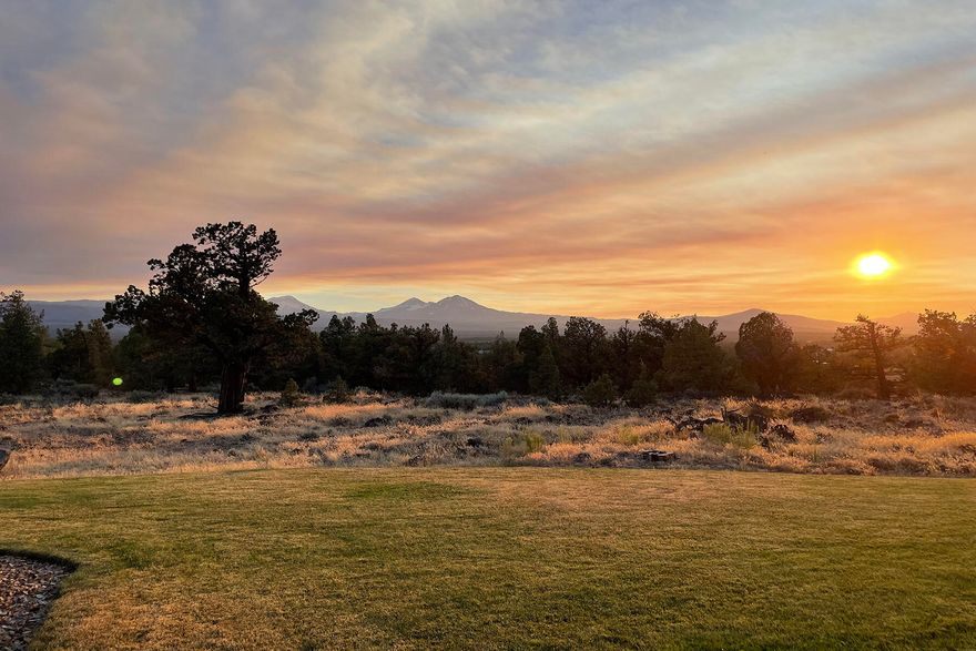 Nested on the top of the hillside this 25 acre property offers expansive views of the Cascade Mountain range. Enjoy quality construction with timeless clear alder woodwork, large scale windows that offer an abundance of natural light, temperature controlled wine closet and a concrete roof on the exterior. The kitchen, dining and living room allows for endless opportunity to entertain. The second floor primary suite allows for space and tranquility looking over the property and the mountain views.  The driveway is paved from the street and has a gated entrance shared with one neighbor as well as a detached garage for extra storage, water feature and large patio at the back of the home. This home is a short distance to Bend, Sisters and Redmond. Come take a tour today!