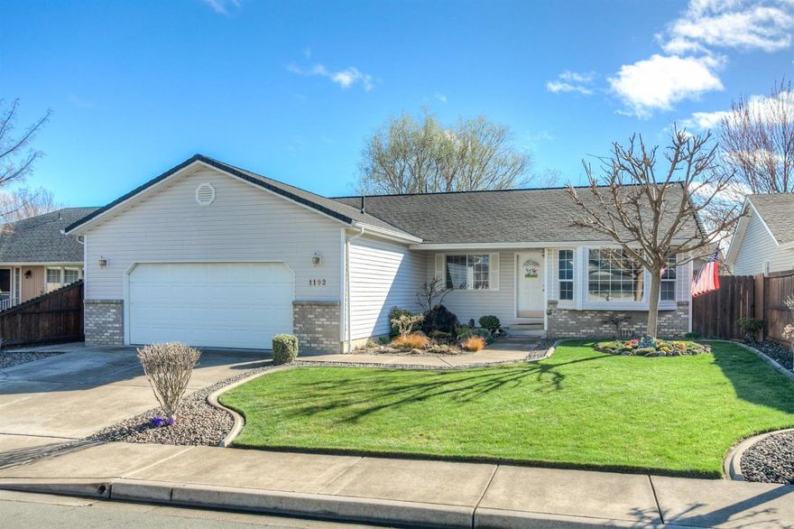 Beautifully upgraded home with open floor plan. Well manicured yard with front pond-less waterfall system welcomes you into this home. Amazing hickory wood floors. Formal Living + Dining Room...or make it into a 3 bedroom + office! Kitchen features Cherry stained cabinets. Upgrades include new gas furnace, new carpet, paint, flooring and bathroom upgrades. Master has large walk-in closet. On the outside you will find low maintenance vinyl siding, new 50 year roof, newer vinyl windows and a dog run on the side of the home. The backyard has a 10 X 16' cottage/storage shed for the avid gardener. This home is BETTER than new and turn key ready...all in the coveted Central Point Elementary school district.