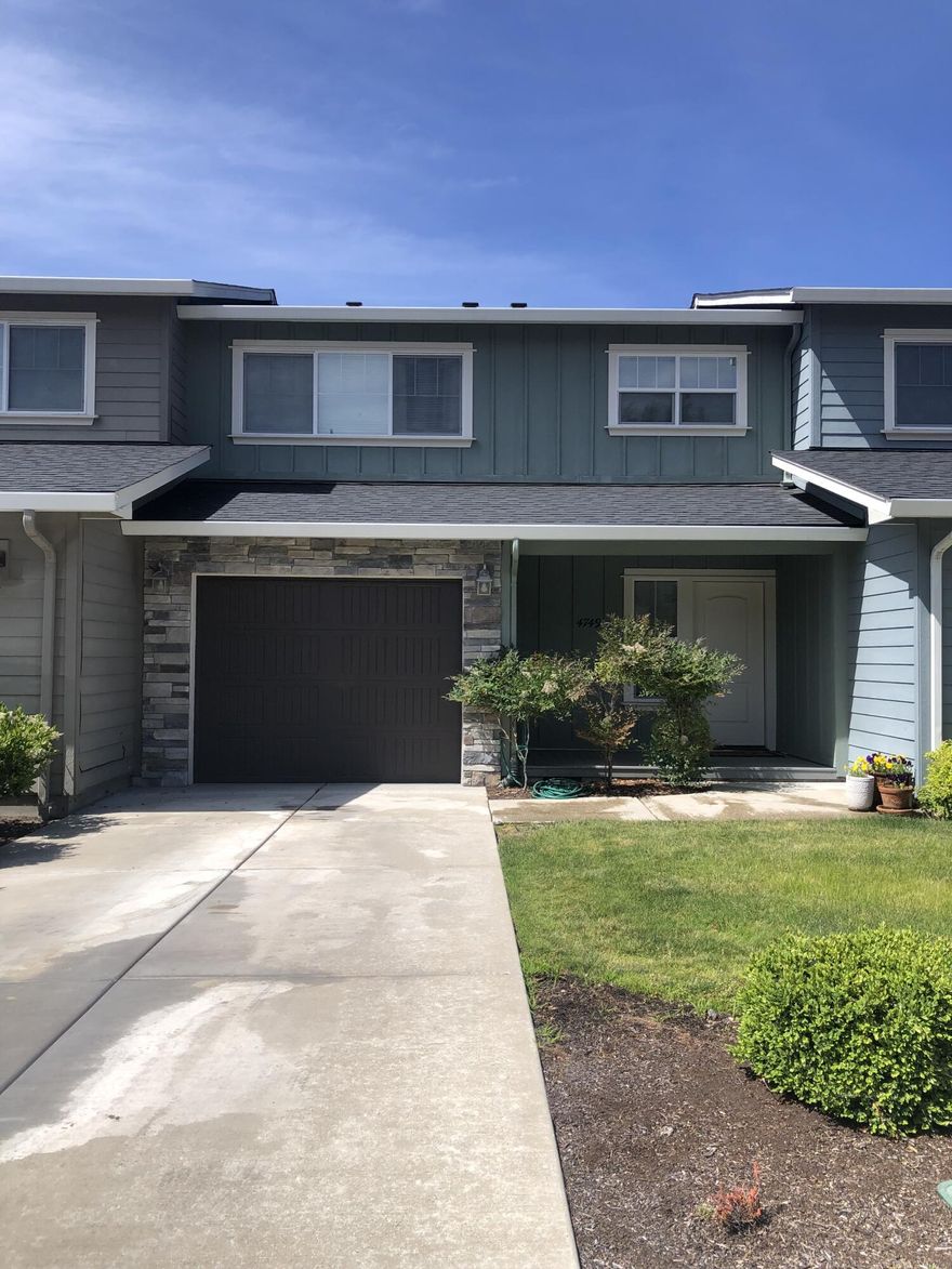 Desirable East Medford Townhome with views! Enter the main floor to an open concept living room, dinning and kitchen. Kitchen has granite countertops with large island, stainless steel appliances, gas stovetop and loads of storage. Wall of windows and double French doors lead to a large covered deck with beautiful views of Roxy Ann. Head upstairs to the large master suite with granite countertop dual vanity, walk-in closet and more views. Second bedroom also has its own en-suite bath with walk-in closet as well. Head downstairs from the main floor and there's a family room with a French door leading to the patio with gated fenced yard and raised garden beds. Opening out to a large community common area which ensures no one builds behind you. Also on the lower floor is the third bedroom, third full bathroom, oversized closets and an abundance of storage.