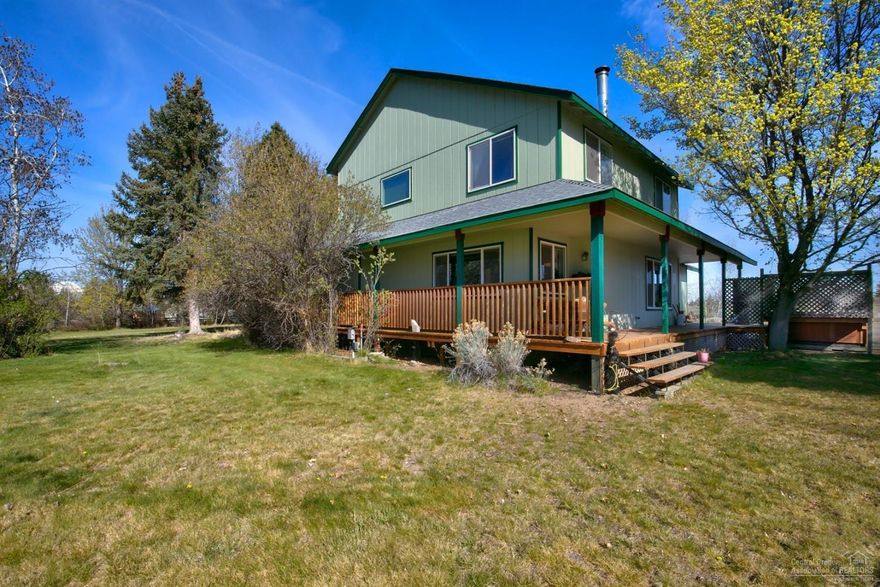 Park like setting on 2.8 acres with 2 acres of Swalley irrigation water rights. Country home is 1945 sf 3 bedrooms, 2.5 bathrooms, wrap around covered porch, living and family rooms, utility room, woodstove and attached 2 car garage. Shop is 1296 sf, concrete floors, office and storage. Property: Detached 3 car garage, garden, fenced, gated, landscaped, sprinkler system, pond, peekaboo Cascade Mountain Views. Terrific location between Bend and Redmond. Call for appointment today.