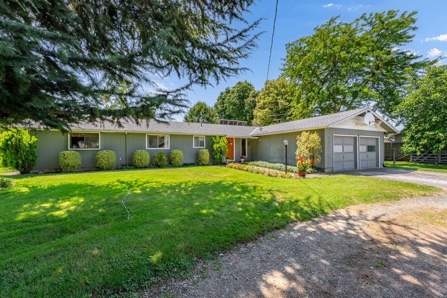 Discover the perfect blend of country living and in-town convenience with this 3-bedroom, 2-bath home on just over an acre in the city of Medford. Featuring incredibly fertile soil, a large garden, and ample space for livestock, this property is ideal for those seeking a rural lifestyle with urban access. It offers an amazing well, Talent Irrigation District water rights, and public sewer—an uncommon and valuable combination. The home is ready for your personal touch and renovation, providing a solid foundation to create the space you've always envisioned. With potential for additional development (buyer to verify with Jackson County), this versatile property is a rare opportunity within city limits.