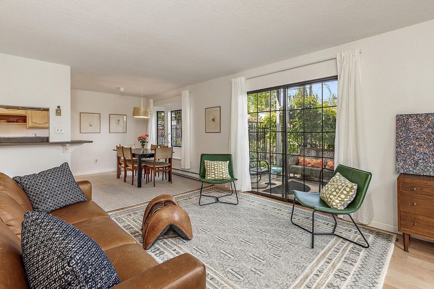 If you love mountain views and indoor-outdoor living this light-filled end unit condo in a private and well-cared-for community is for you. This recently renovated home has a Scandinavian feel and features new engineered hardwood maple flooring, wool carpet, fresh paint, and fixtures. Enjoy indoor-outdoor living with a private patio off the spacious living room. A kitchen and half bathroom with tile flooring round out the open floor plan living space. Upstairs are two bedrooms with large windows, mountain views, large closets and maple flooring and a full bathroom with tile flooring. The primary bedroom has a balcony with views of Grizzly Peak and is a perfect place to enjoy the ever changing mountain vistas. The park-like common outdoor spaces are filled with lush and mature landscaping. This property sits close to downtown Ashland and Lithia Park. HOA dues are $210 a month and cover the assigned carport with storage, water, roof, sewer, garbage, landscaping, and exterior maintenance.