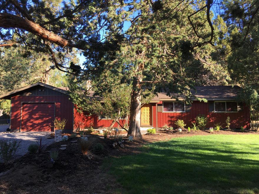 Enjoy the serenity of this tranquil setting in much desired, well-established Tillicum Village, a place that deer, squirrels, and birds also call their home.  Wonderful, rare 0.29 acre lot with mature landscaping and plenty of room for your RV. A fenced, deer-protected, sunny organic garden adds to the spacious backyard. Move-in ready with new interior and exterior paint; kitchen remodel, including, high end appliances and fresh bathroom updates. Beautiful solid hardwood floor in the living room and a spacious hobby/shop/multi-purpose room adds to the charm.  Close to schools, shopping and all that Central Oregon has to offer.