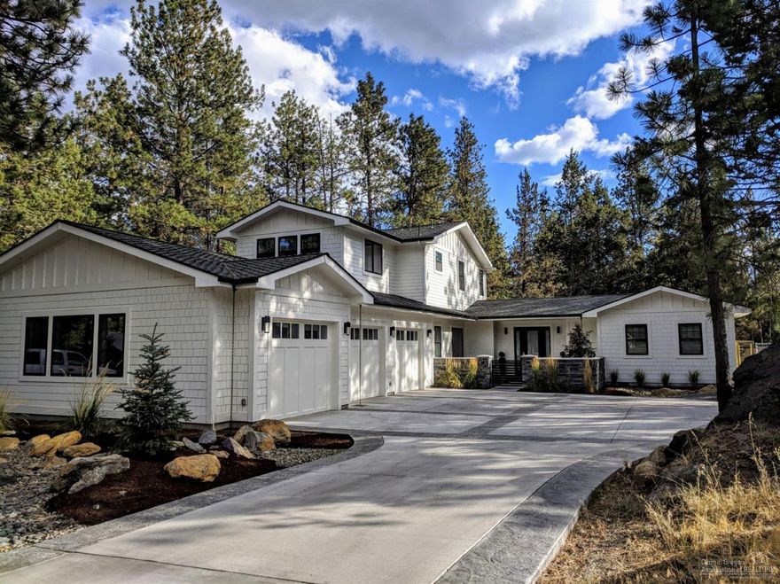 This beautiful modern farm house in Wood River Village provides easy access to the best stretch of river trail in bend connecting you to Farewell Bend Park, the Old Mill and Downtown. Just 25 minutes from Mt Bachelor and a 10 minute bike ride to reach Phil's Trail system, arguably the best overall location in Bend. The home boasts a chef's kitchen, open concept living, 10 ft ceilings, a huge 3 car garage for all your toys, gated RV parking with full hook-ups, all on a large .42 acre lot with tall pines.