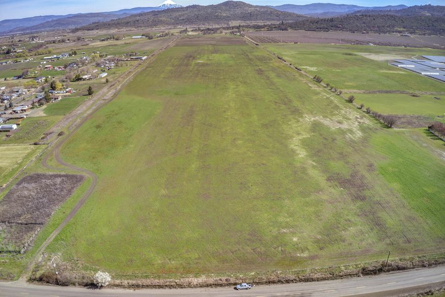Prime Irrigated Farmland! 56.47 Acres with the majority Irrigated through Rogue River Valley Irrigation. Make this location perfect for growing just about anything! (Buyer to do Due Diligence) Zoned EFU, the parcel stretches from McLoughlin Dr to Foothill Dr, fenced on one side. Flat and Usable! Don't miss this opportunity!
